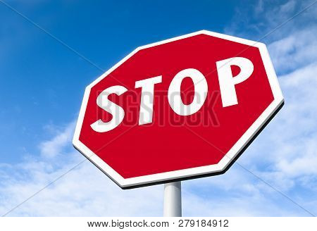 Forefront Of A Stop Sign With A Clear Blue Sky