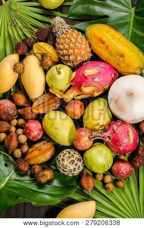 Summer Detox With Vegan Food. Assorted Thai Tropical Fruits On A Dark Wooden Rustic Background.