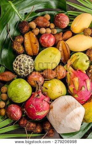 Summer Detox With Vegan Food. Assorted Thai Tropical Fruits On A Dark Wooden Rustic Background.