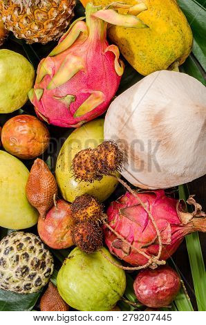 Summer Detox With Vegan Food. Assorted Thai Tropical Fruits On A Dark Wooden Rustic Background.