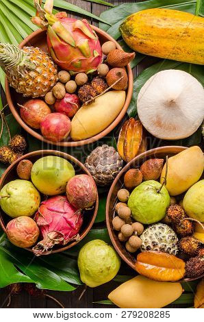 Summer Detox With Vegan Food. Assorted Thai Tropical Fruits On A Dark Wooden Rustic Background.