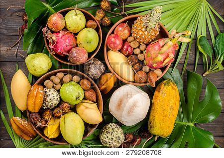 Summer Detox With Vegan Food. Assorted Thai Tropical Fruits On A Dark Wooden Rustic Background.