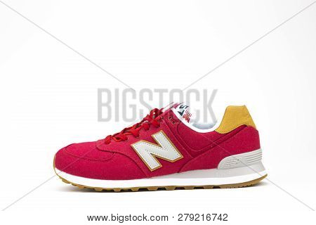 Boston, Ma, Usa, January 2019 - Red New Balance Nb 574 Athletic Shoes On Studio Background. New Bala