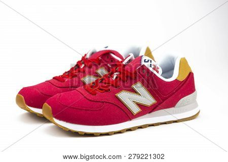 Boston, Ma, Usa, January 2019 - Red New Balance Nb 574 Athletic Shoes On Studio Background. New Bala