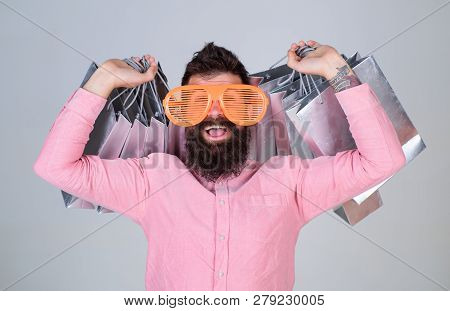 Man Bearded Hipster Wear Sunglasses While Carry Lot Shopping Bags. Shopping On Black Friday. Happy S