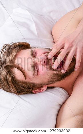 Man Handsome Guy Lay In Bed. Get Adequate And Consistent Amount Of Sleep Every Night. How Much Sleep