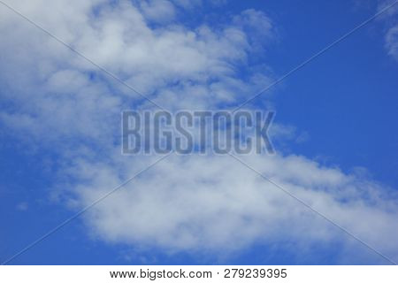 The White Clouds In The Sky Are Borne By The Wind.