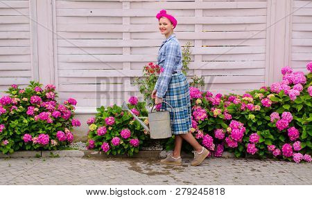 Greenhouse Flowers. Hydrangea. Spring And Summer. Happy Woman Gardener With Flowers. Flower Care And