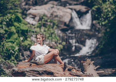 Little Girl Enjoying View Of Waterfall In Krasnay Poliana