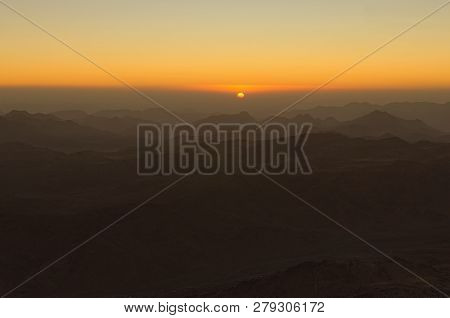 Scenic Sunrise In The Mountains. The Sun Comes Out From The Cloud. View From Mount Sinai (mount Hore