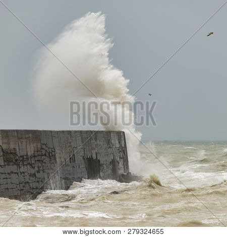 Stunning Waves Crashing Over Harbor Wall During Windy Storm At Newhaven On English Coast