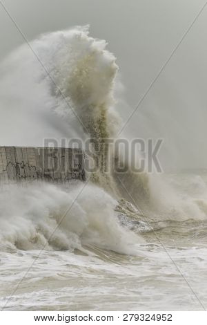 Stunning Waves Crashing Over Harbor Wall During Windy Storm At Newhaven On English Coast