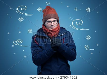 Young hipster frozen boy with doodled snowflakes and windy concept