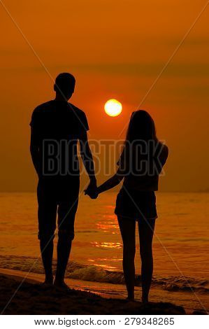 Lovers On The Sea Looking At The Sunset. Selective Focus