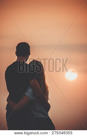 Lovers On The Sea Looking At The Sunset. Selective Focus