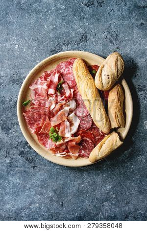 Antipasto Meat Platter Assorti Of Sliced Jamon, Salami, Chorizo Sausage In Ceramic Plate With Bread 