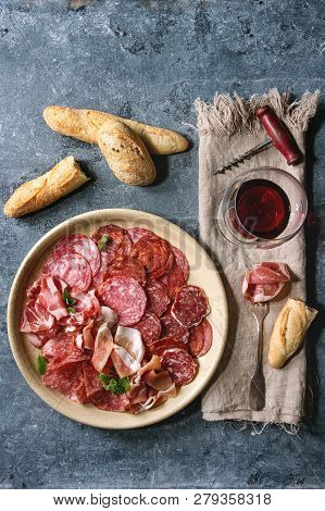Antipasto Meat Platter Assorti Of Sliced Jamon, Salami, Chorizo Sausage In Ceramic Plate With Bread 