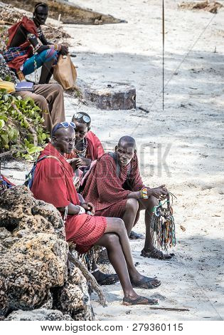 Diani Beach, Kenya - October 14, 2018: Unindentified African Men Wearing Traditional Masai Clothes O