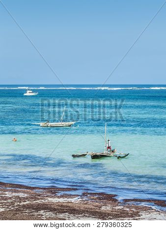 Diani Beach, Kenya - October 14, 2018: Unindentified African Man And His Traditional Wooden Boat On 