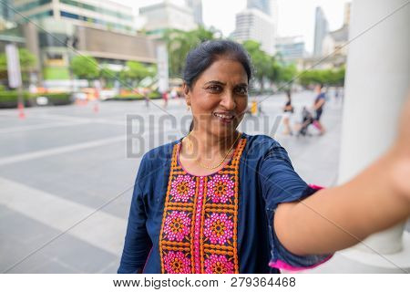 Personal Point View Of Mature Indian Woman Taking Selfie