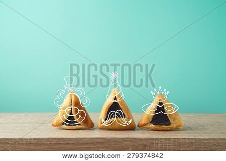 Jewish Holiday Purim Concept With Cute Hamantaschen Cookies Characters On Wooden Table