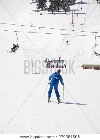 Skier In A Winter Resort