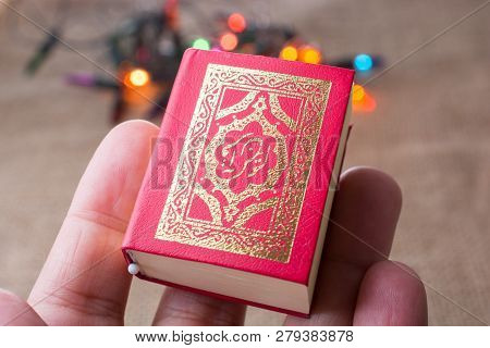 Islamic Holy Book Quran With Lights Behind
