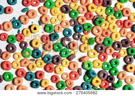 Background Of Colorful Cereal Rings. Multicolored Cereal Rings On White Background. Flat Lay, Top Vi