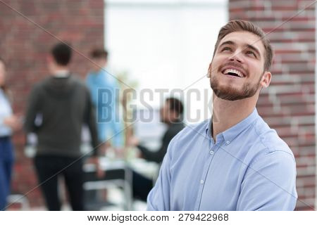Cheerful man smiling  in office.