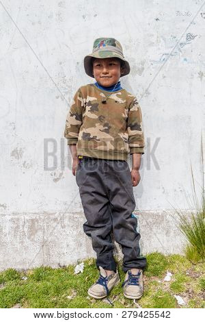 Amantani, Peru - May 15, 2015: Native Boy In A Village On Amantani Island In Titicaca Lake, Peru
