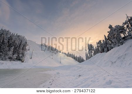 Rukatunturi Ski Jumping Hill In Winter Season And Nice Weather And Blue Sky In Winter Season And Sun