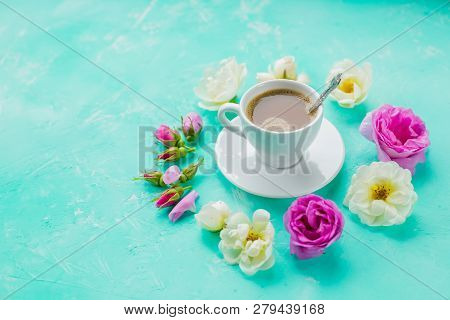 Colorful Flowers And Morning Cup Of Coffee On Blue Background. The Concept Of Hot Drink, Coffee For 