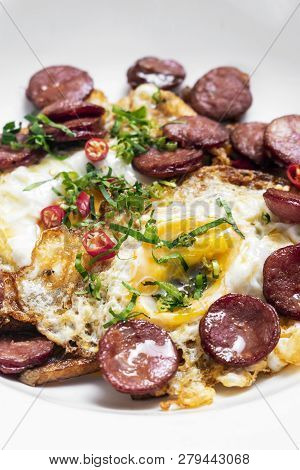 Spicy Chorizo Sausage And Eggs Spanish Huevos Rotos With Fries Tapas Snack