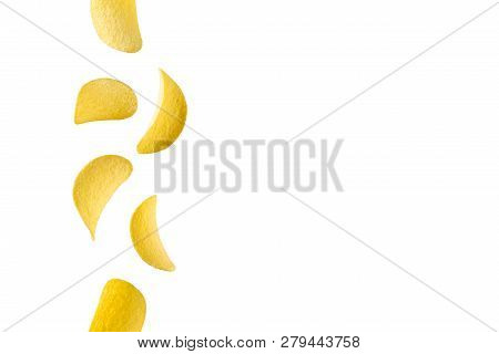 Falling Potato Chips Isolated On White Background. Flying Crispy Snacks