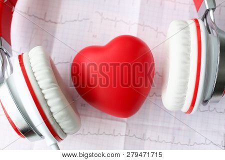 Red Toy Heart An Heaphones On Paper Cardiogram Background Closeup Concept