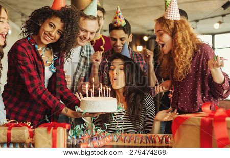 Friends Making Surprise With Cake And Canles For A Birthday Girl. Surprise Birthday Party Concept