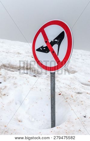 Prohibition Sign Forbidding Women To Walk On Deep Snow Wearing Shoes With Spike Heels.