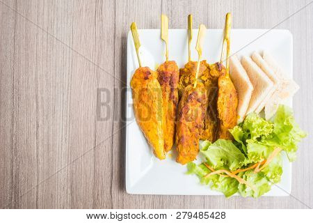 Image Of Grilled Chicken Satay In White Plate