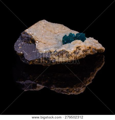 Natural Cavansite Stone On Substrate On Black Background With Reflection