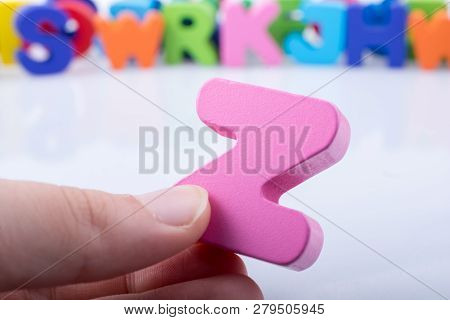Hand Holding Letter Cube Z Of Made Of Wood