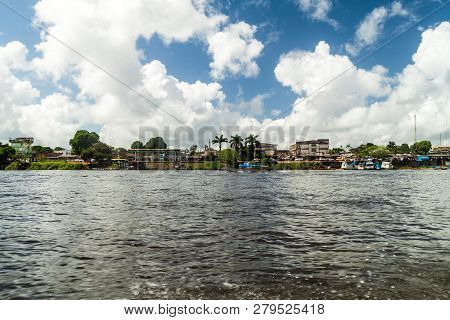 Oiapoque, Brazil - August 1, 2015: Rierside Buildings Of Oiapoque Town On Oiapok Oiapoque Or Oyapock
