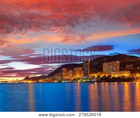 Alicante skyline at sunset from Albufereta beach in Spain Costa Blanca
