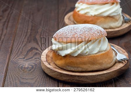 Traditional Swedish Dessert Semla, Also Called Shrove Bun, With Almond Paste And Whipped Cream Filli