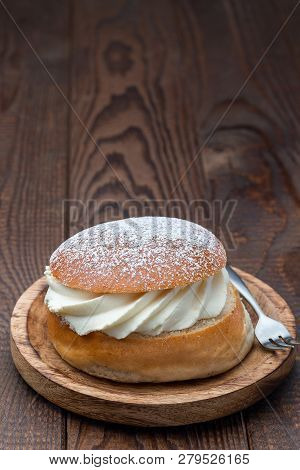 Traditional Swedish Dessert Semla, Also Called Shrove Bun, With Almond Paste And Whipped Cream Filli