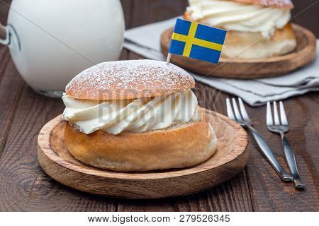 Traditional Swedish Dessert Semla, Also Called Shrove Bun, With Almond Paste And Whipped Cream Filli