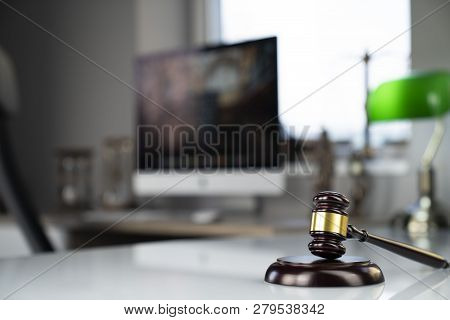 Lawyers Office. Gavel And Computer On The White Table.