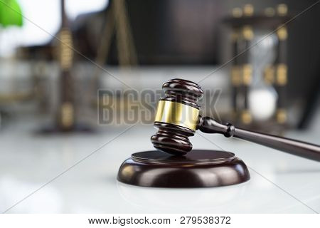 Lawyers Office. Gavel And Scale  On The White Table.