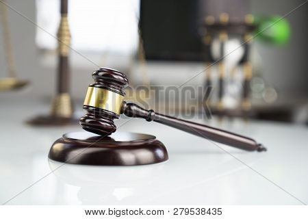 Lawyers Office. Gavel And Computer On The White Table.