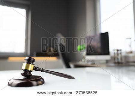 Lawyers Office. Gavel And Computer On The White Table.