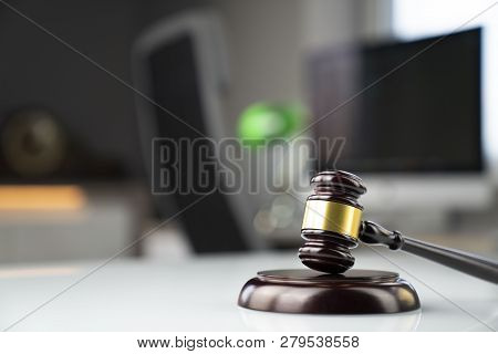 Lawyers Office. Gavel And Computer On The White Table.